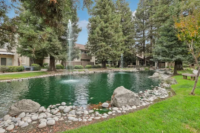 a view of a swimming pool with a patio