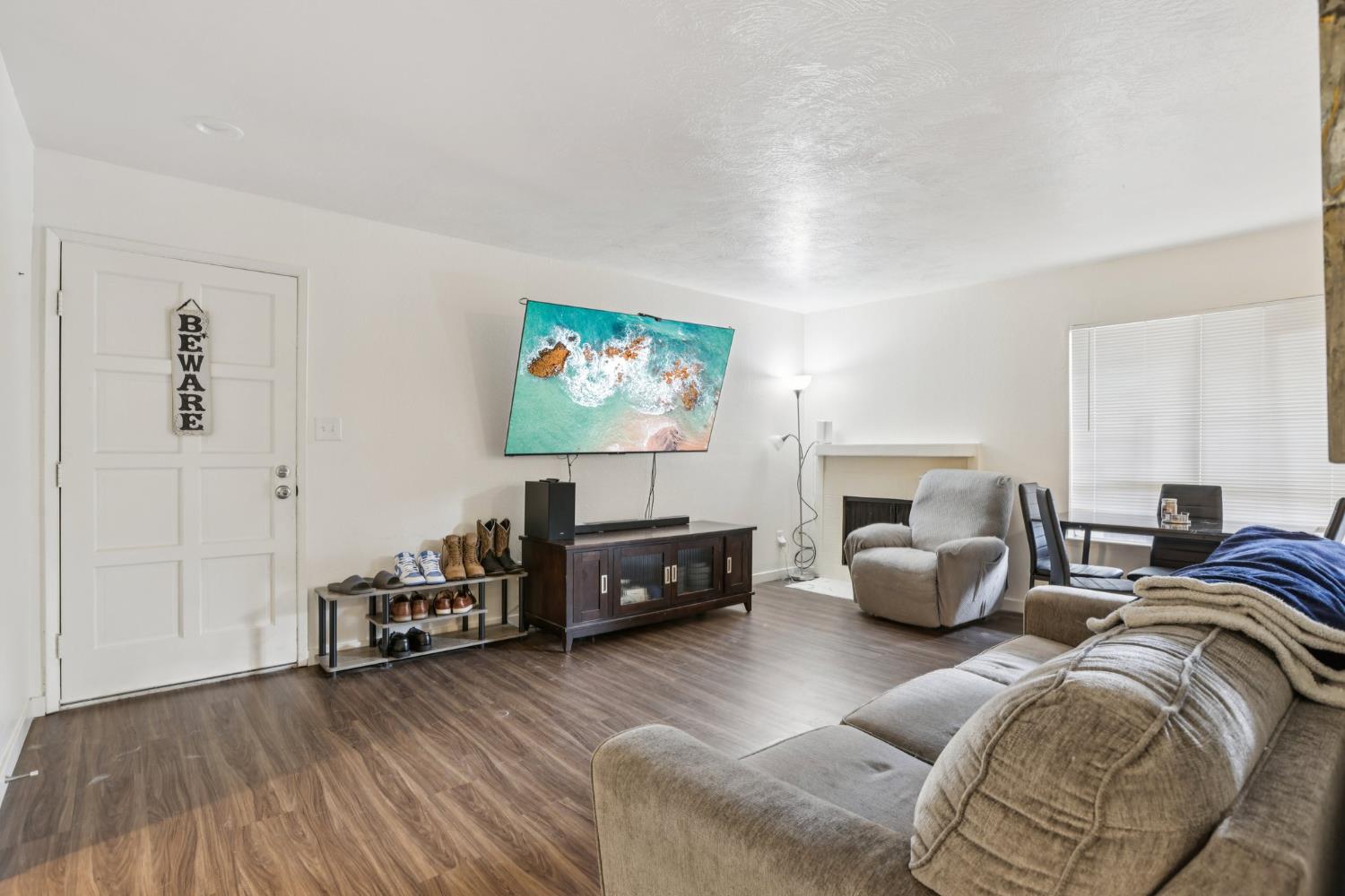 3700 Tully Road, Unit 57 Modesto, CA 95356 - Photo 6 of 34 a living room with furniture and a flat screen tv