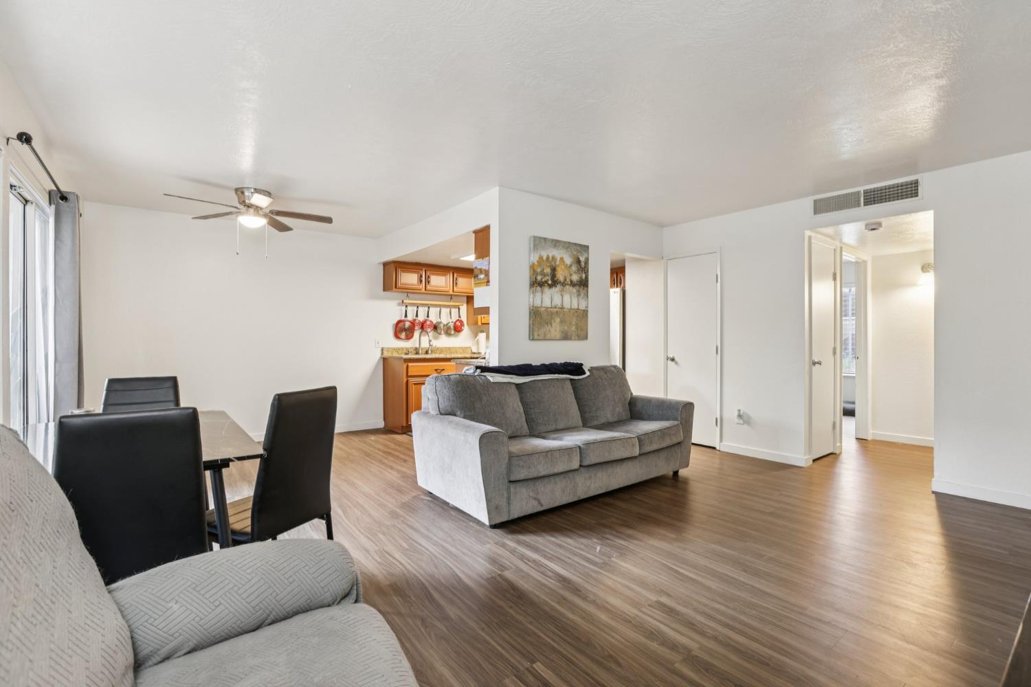 3700 Tully Road, Unit 57 Modesto, CA 95356 - Photo 8 of 34 a living room with furniture and a wooden floor