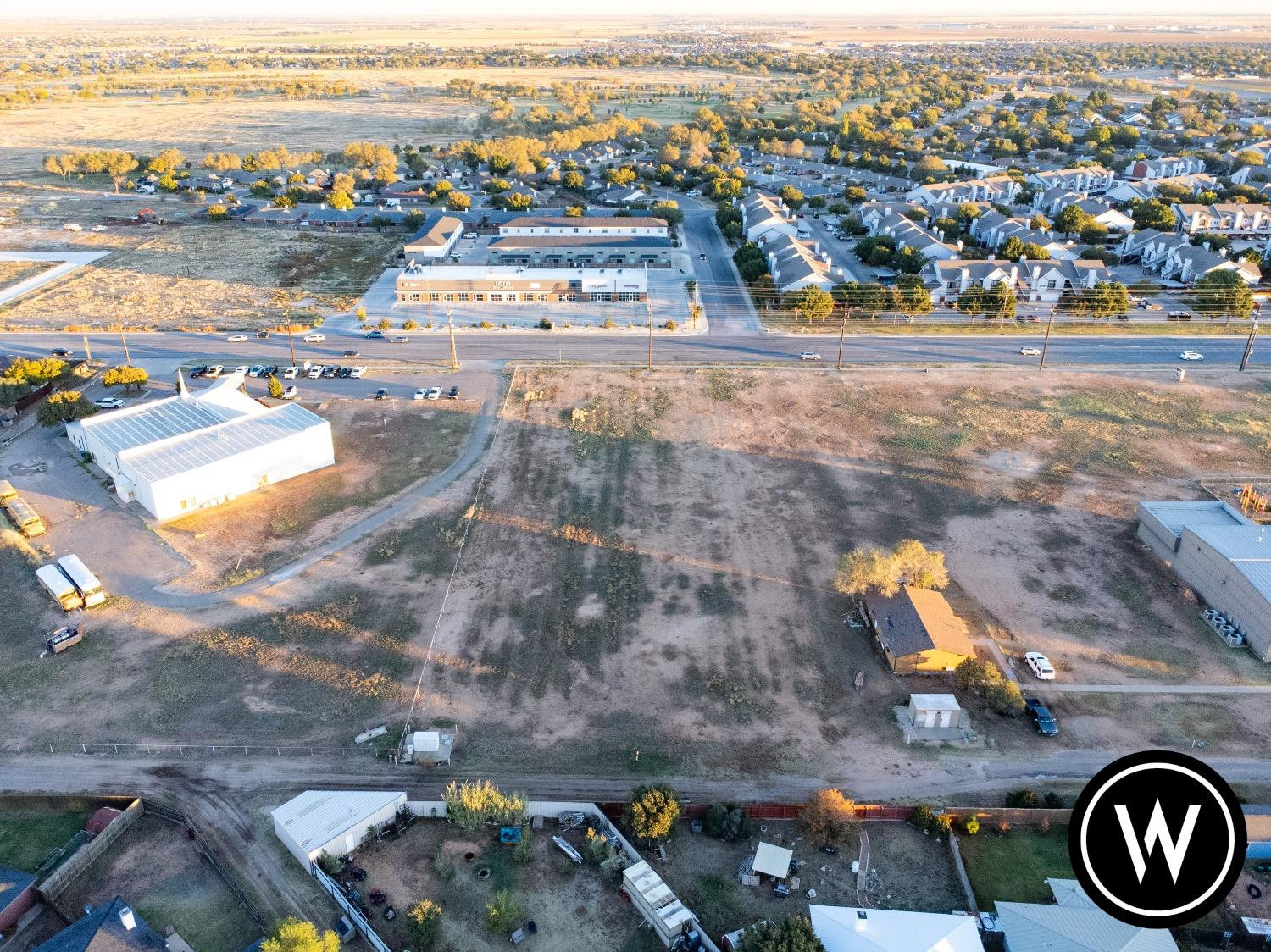 6000 4th Street Lubbock, TX 79416 - Photo 16 of 22 an aerial view of residential houses with outdoor space