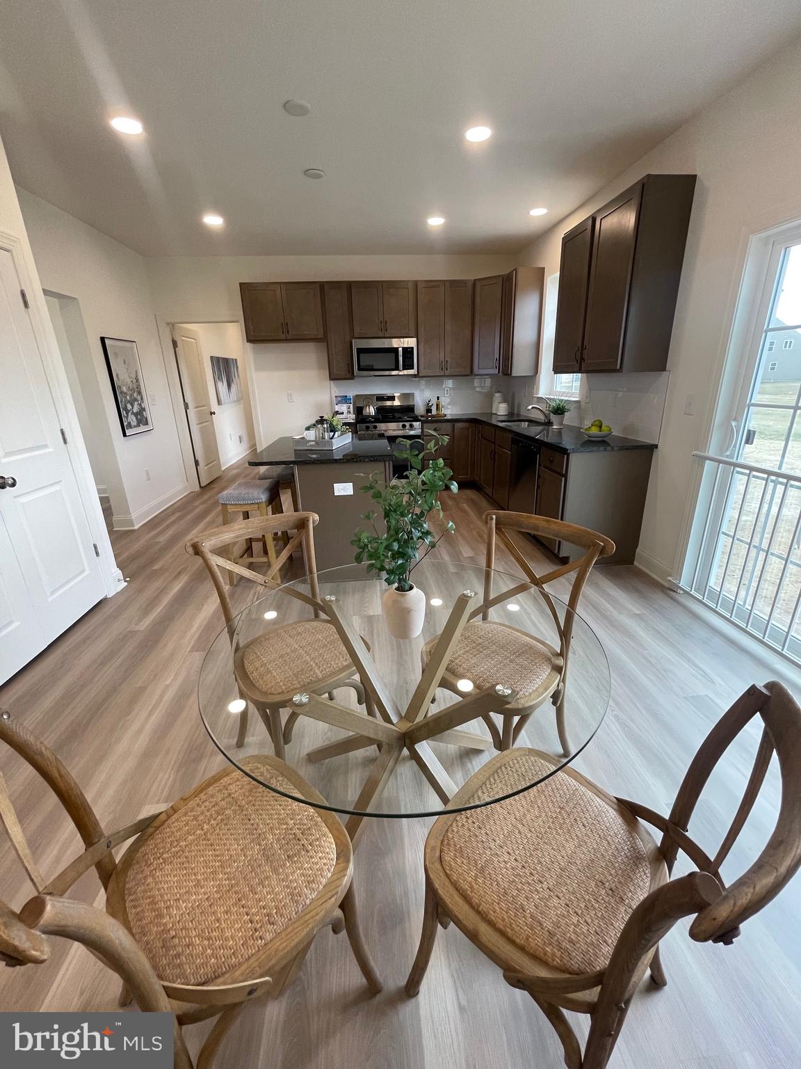 642 Gordon House Way Middletown, DE 19709 - Photo 10 of 25 a view of kitchen with stainless steel appliances granite countertop a dining table and chairs