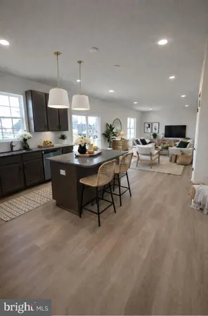 a kitchen with a stove a microwave a sink and cabinets