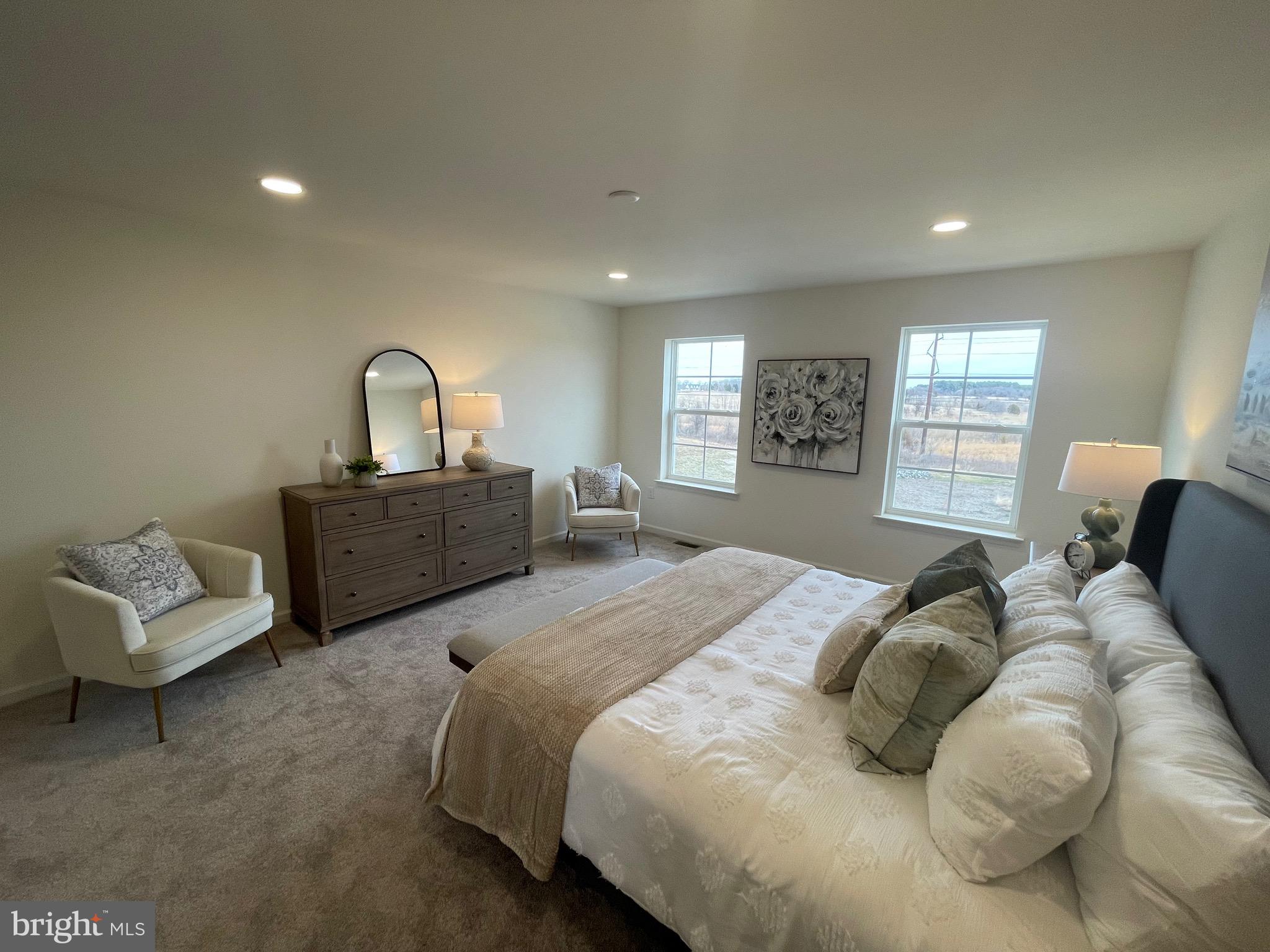 642 Gordon House Way Middletown, DE 19709 - Photo 18 of 25 a spacious bedroom with a bed window and couch