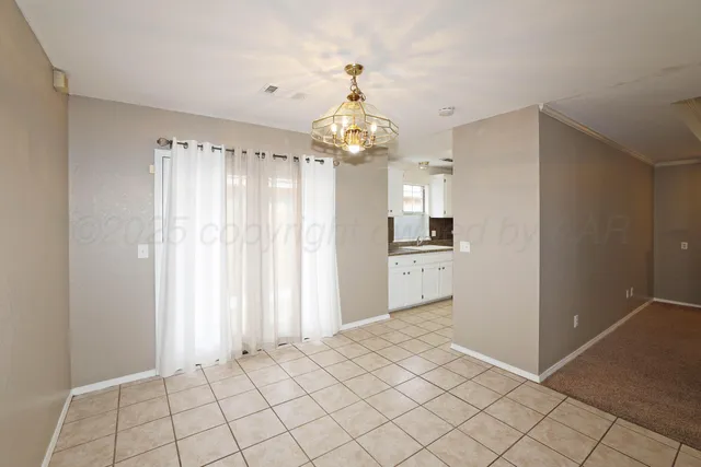 a view of a kitchen with a sink and a window