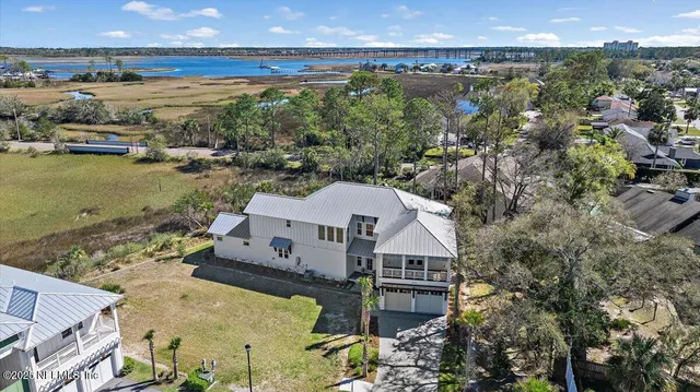 aerial view of a house with a lake view