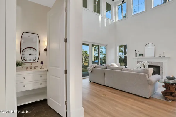 a kitchen with stainless steel appliances granite countertop a stove a sink and a white cabinets