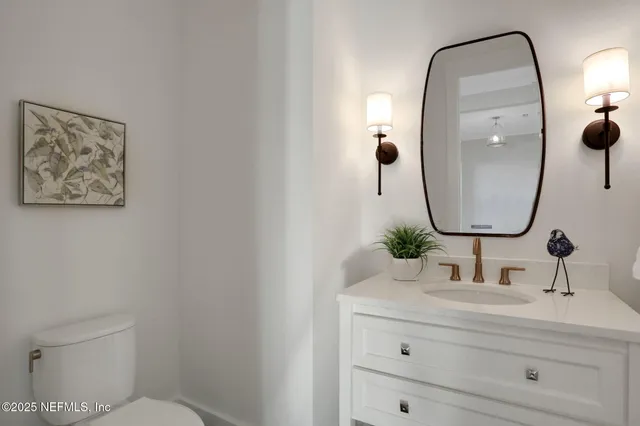 a kitchen with a dining table cabinets and stainless steel appliances