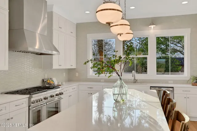 a view of a hallway with floor to ceiling window and wooden floor