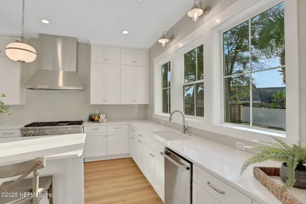 a bathroom with a sink double vanity and a mirror
