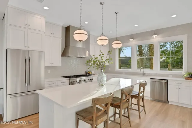 a spacious bedroom with a bed and a window
