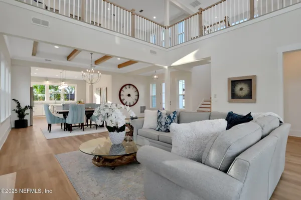 a view of a dining room with furniture and a wooden floor