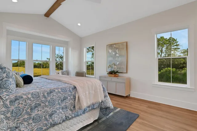 a bathroom with a sink a toilet a shower and a mirror