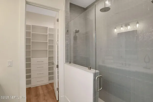 a view of a balcony with wooden floor