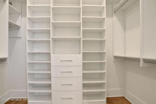 a balcony with wooden floor and outdoor seating