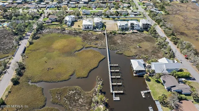 a kitchen with granite countertop a sink stove and cabinets