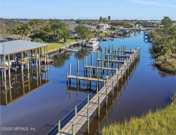 a kitchen with a table chairs sink and cabinets
