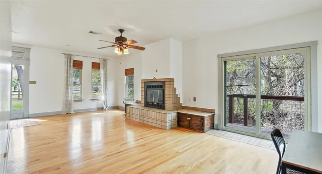 a spacious bedroom with a bed and a fireplace
