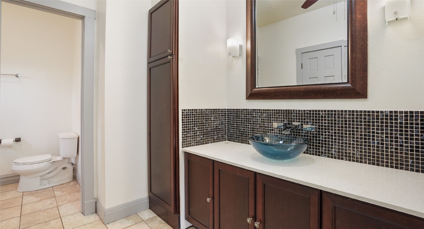 13918 Hummingbird Lane Austin, TX 78732 - Photo 21 of 36 a bathroom with a sink a toilet and mirror