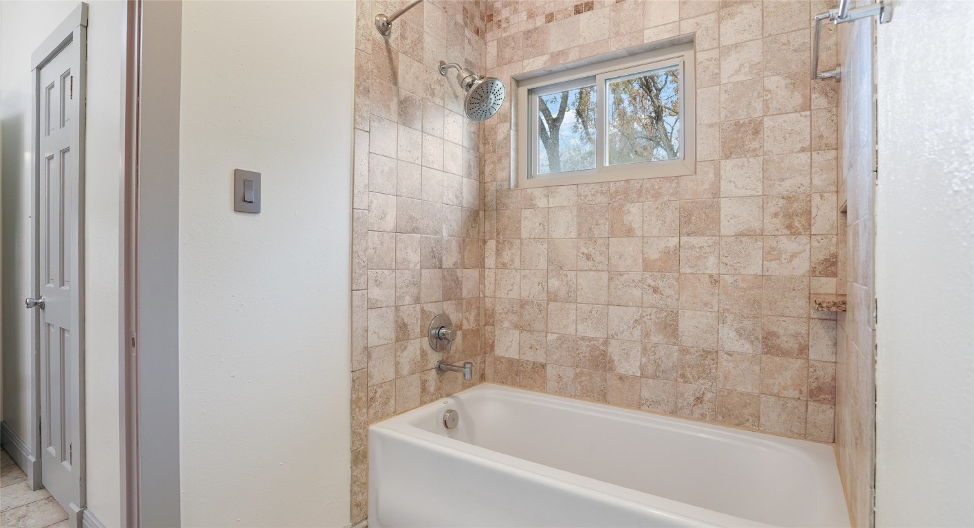 13918 Hummingbird Lane Austin, TX 78732 - Photo 22 of 36 a bathroom with a bathtub