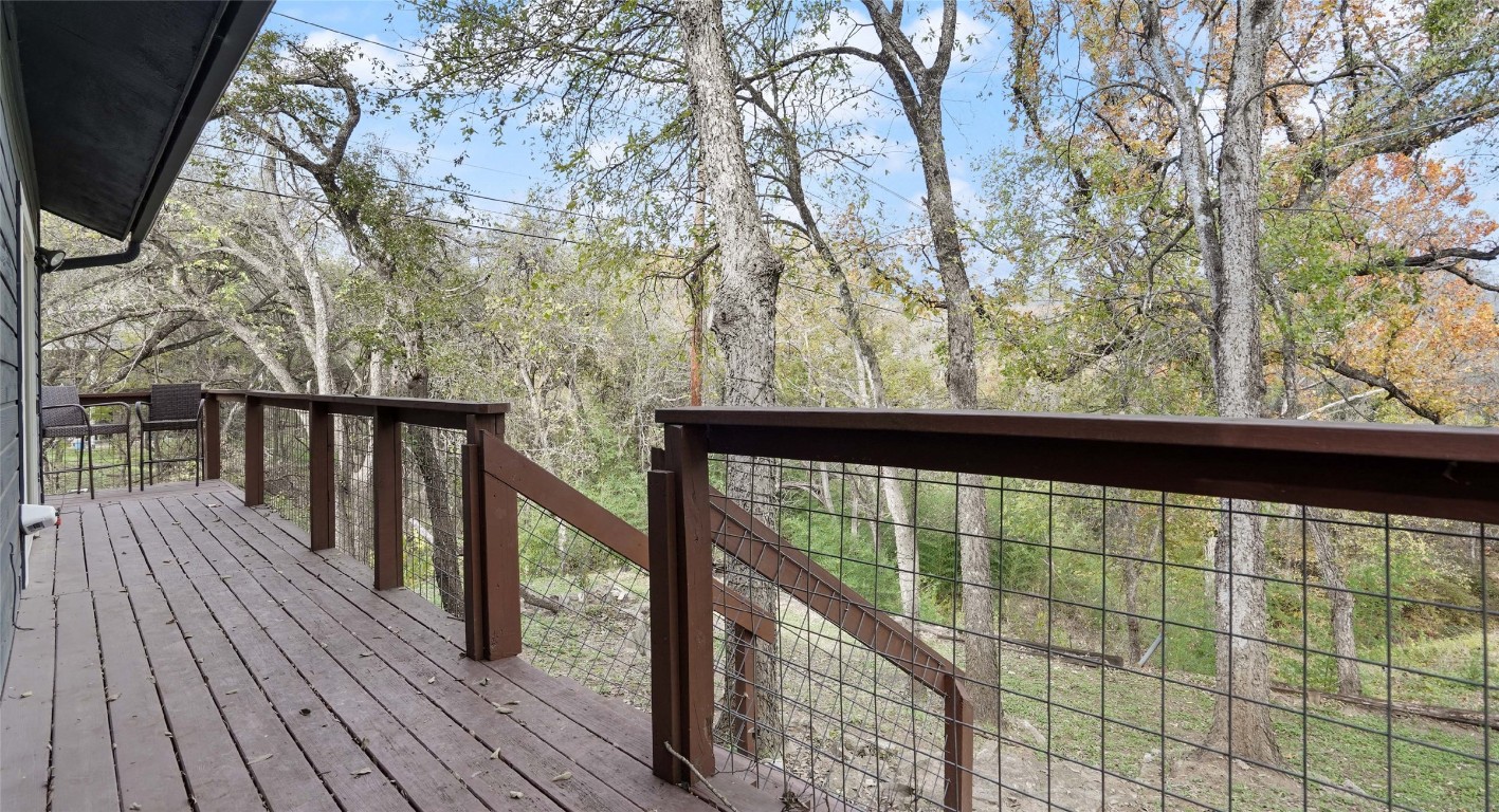 13918 Hummingbird Lane Austin, TX 78732 - Photo 24 of 36 a view of balcony with wooden floor and fence