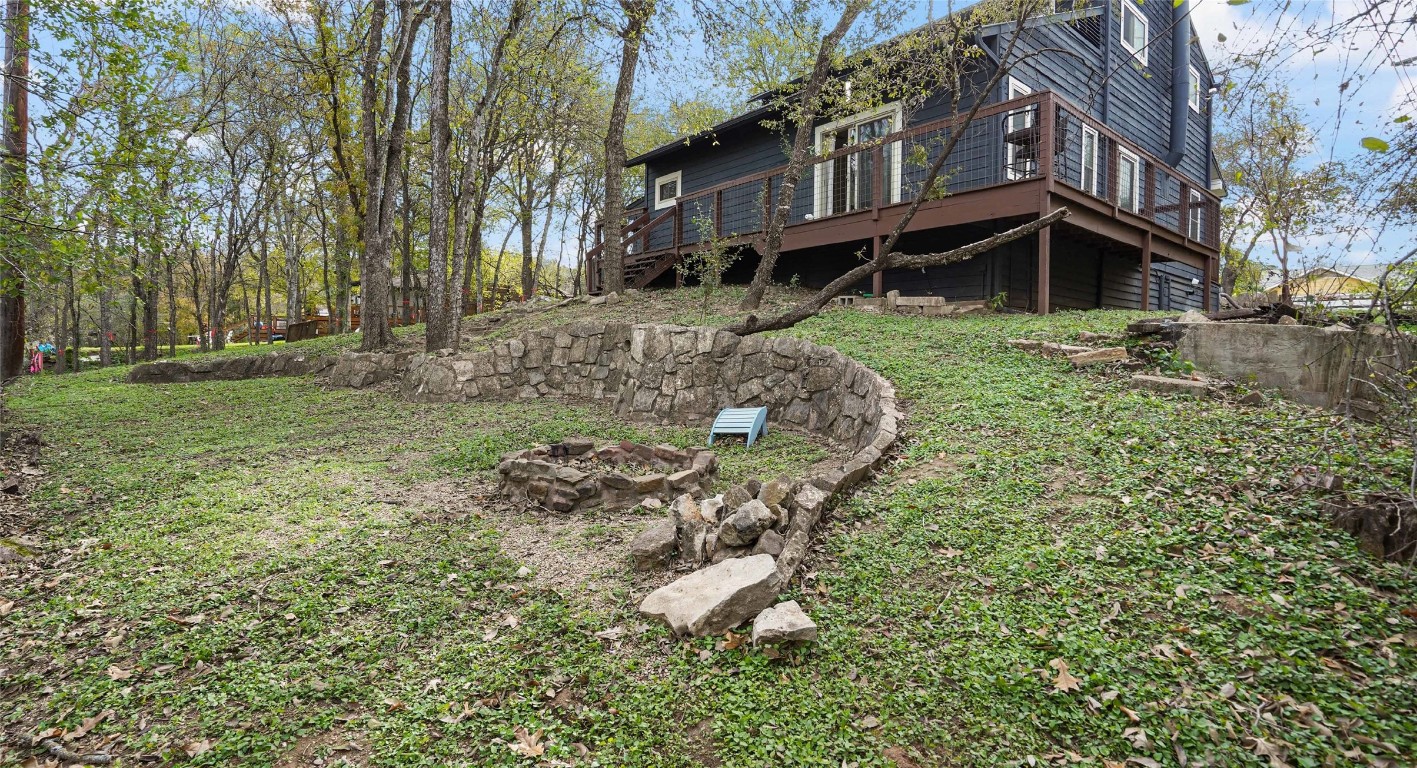13918 Hummingbird Lane Austin, TX 78732 - Photo 26 of 36 a backyard of a house with lots of green space