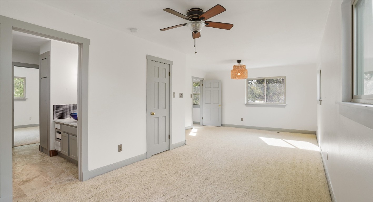 13918 Hummingbird Lane Austin, TX 78732 - Photo 29 of 36 a view of a livingroom with a ceiling fan and window