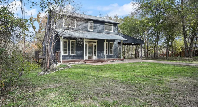 a front view of a house with yard