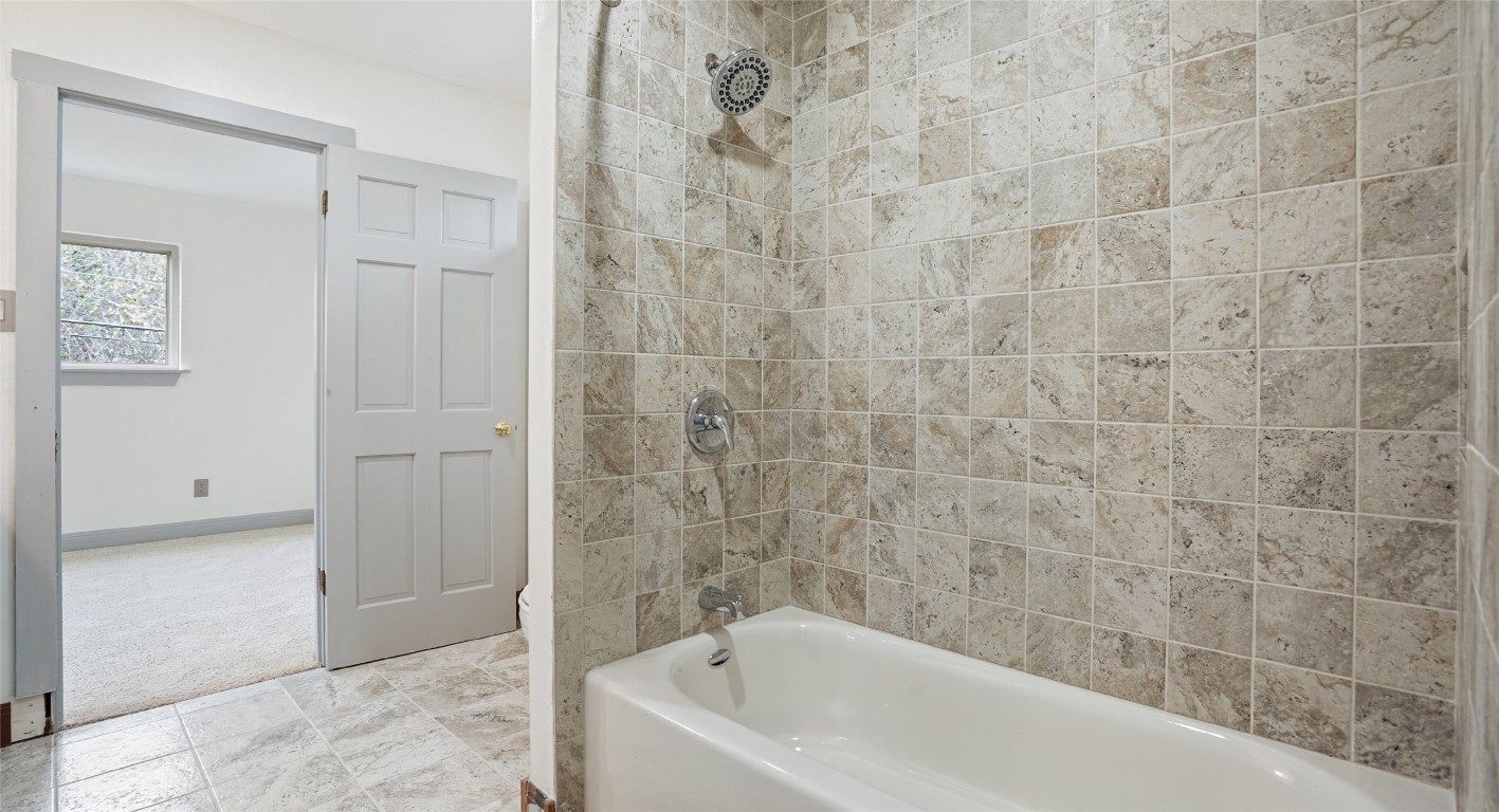 13918 Hummingbird Lane Austin, TX 78732 - Photo 32 of 36 a bathroom with a bathtub