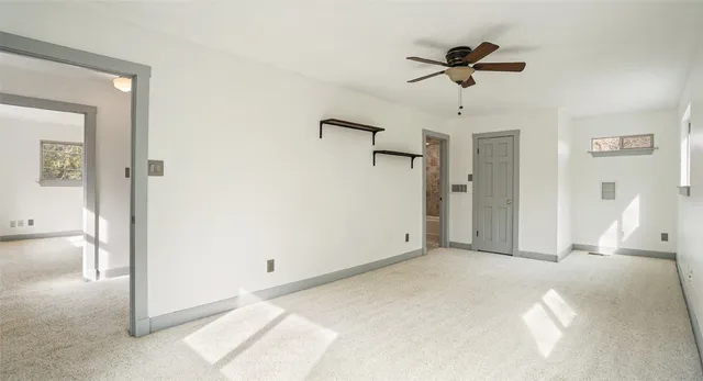 a view of a livingroom with a ceiling fan
