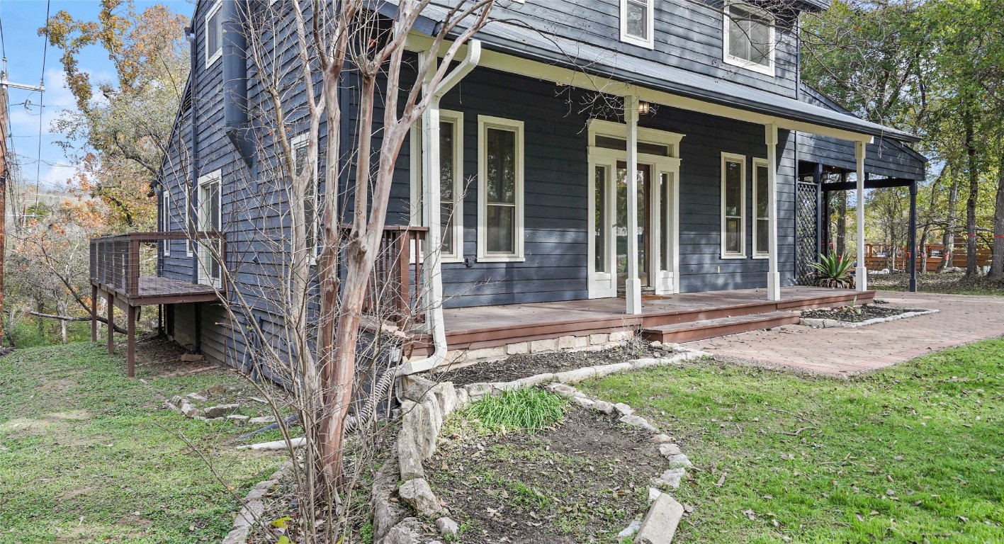13918 Hummingbird Lane Austin, TX 78732 - Photo 4 of 36 front view of a house with a yard