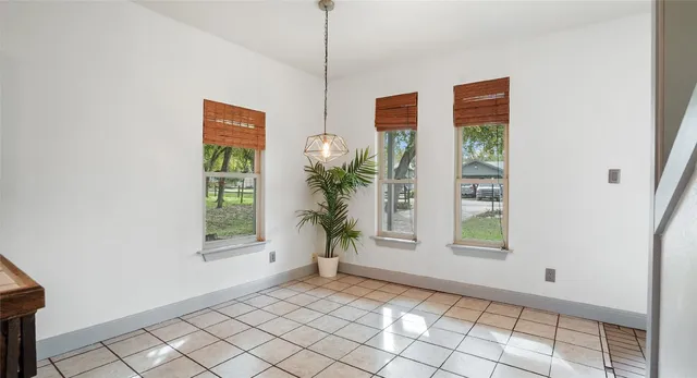 a view of an empty room with windows