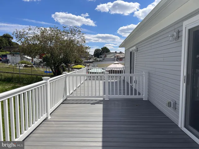 a view of deck with wooden floor and city view