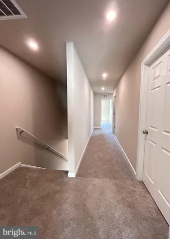 a view of hallway with stairs