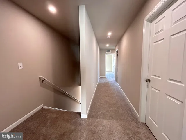 an entryway in a hall with an entryway