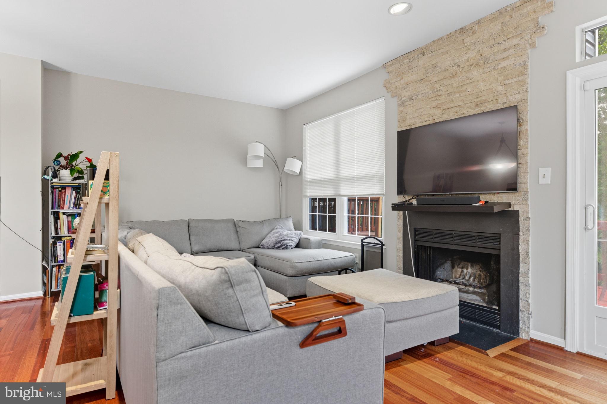 47587 Comer Square Sterling, VA 20165 - Photo 20 of 77 a living room with furniture and a flat screen tv