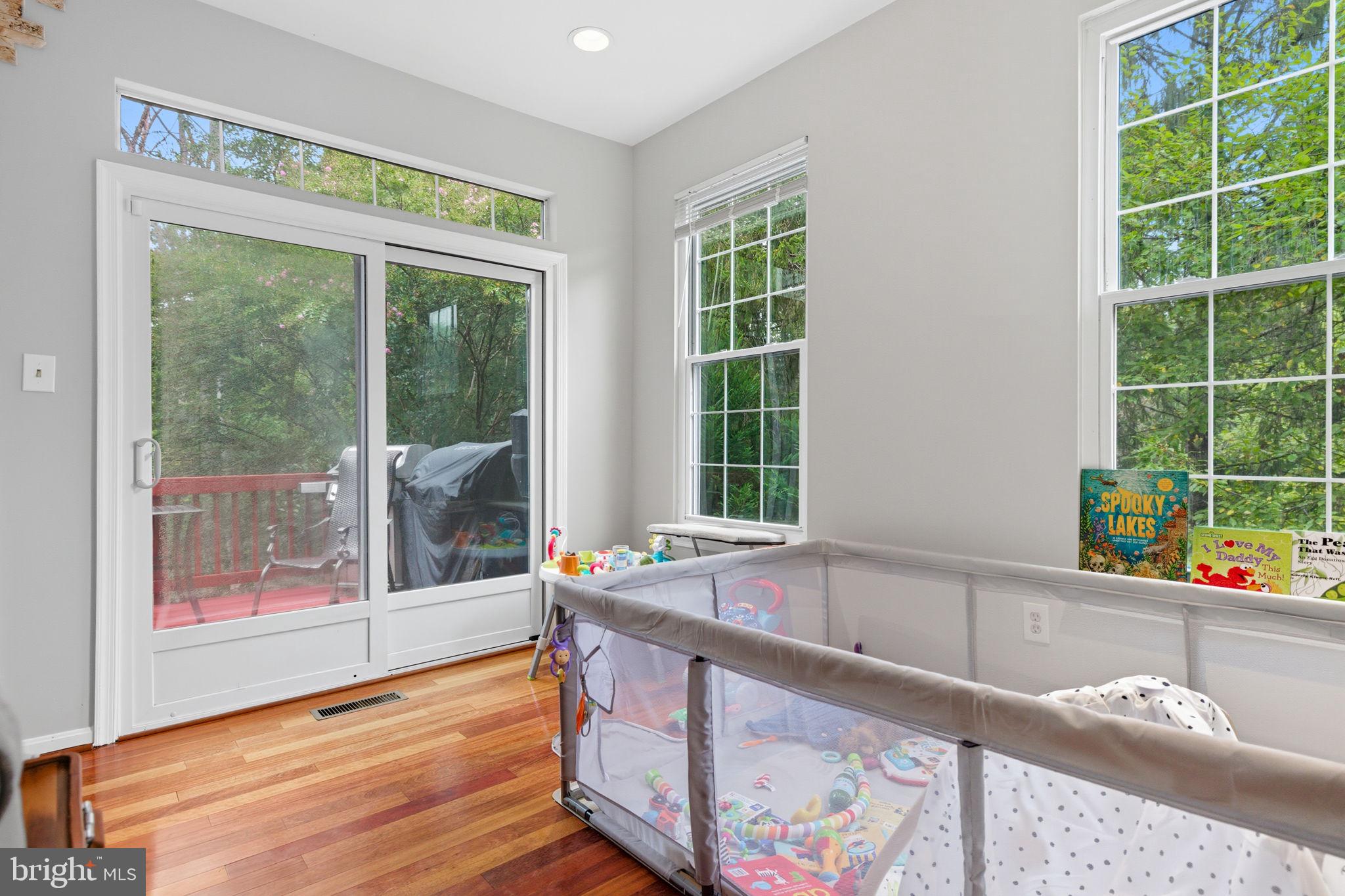 47587 Comer Square Sterling, VA 20165 - Photo 23 of 77 a living room with a large window and a wooden floor