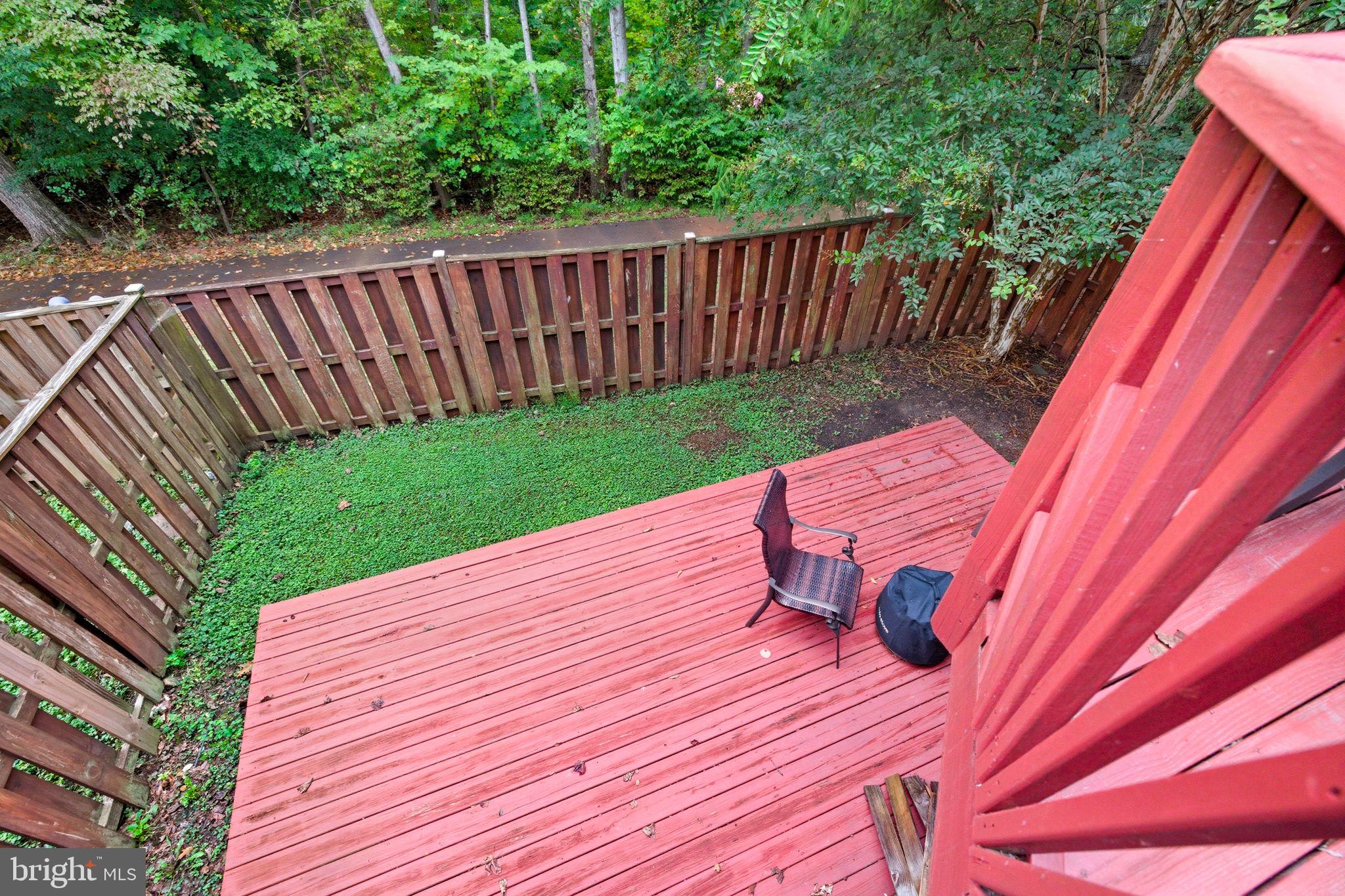 47587 Comer Square Sterling, VA 20165 - Photo 25 of 77 a view of a wooden deck with a wooden fence
