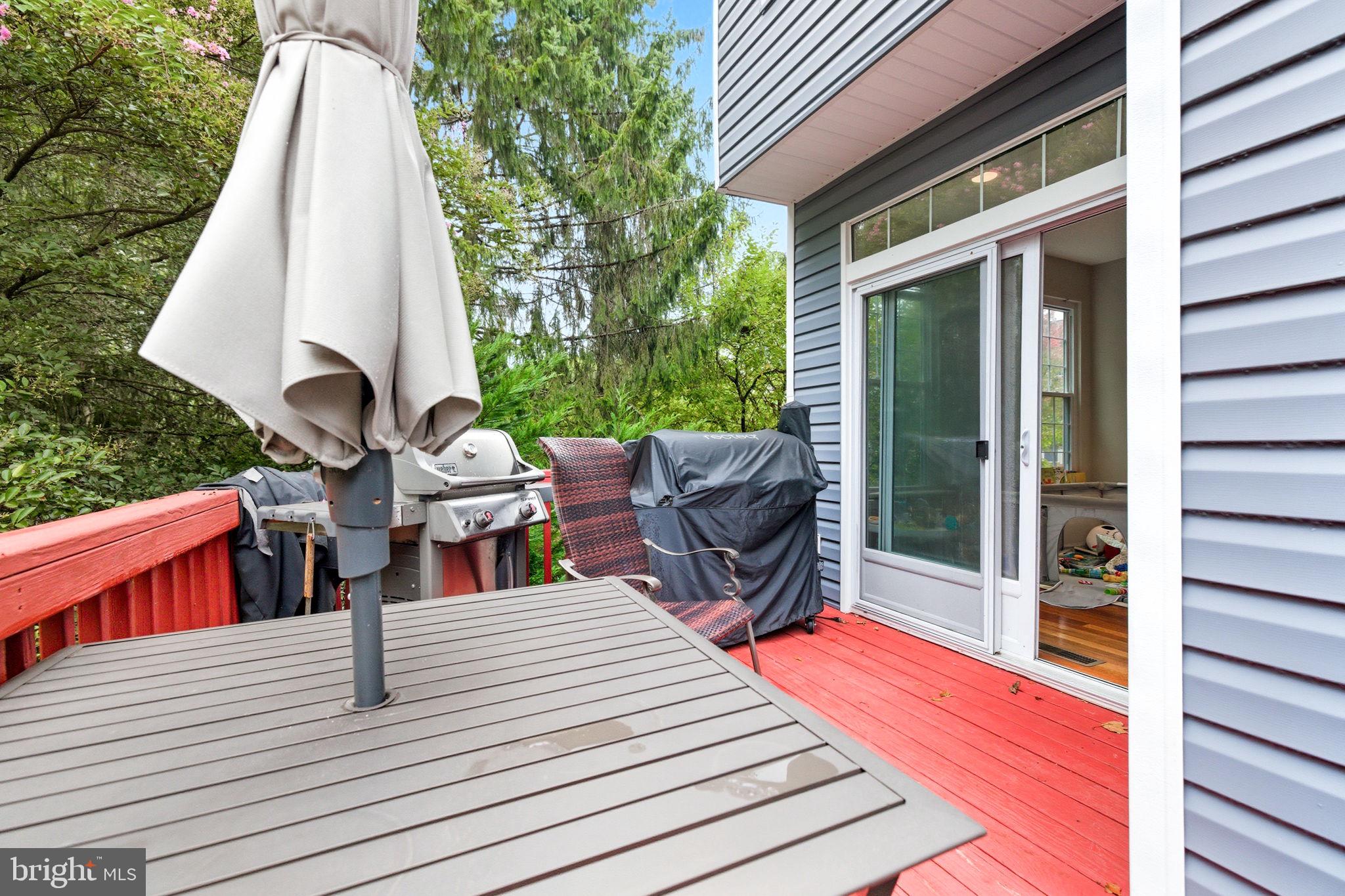 47587 Comer Square Sterling, VA 20165 - Photo 26 of 77 a view of a patio with a table and chairs