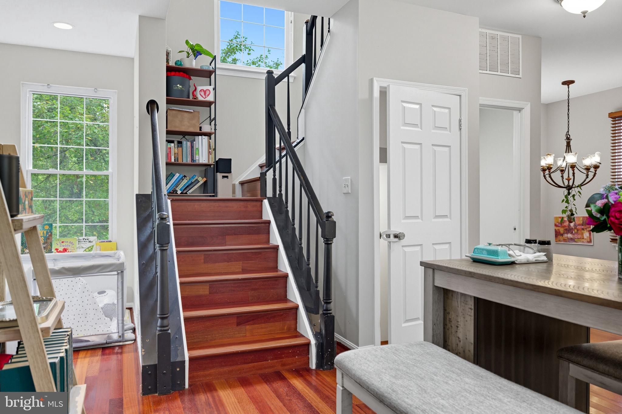 47587 Comer Square Sterling, VA 20165 - Photo 29 of 77 a view of a hallway with wooden floor and staircase