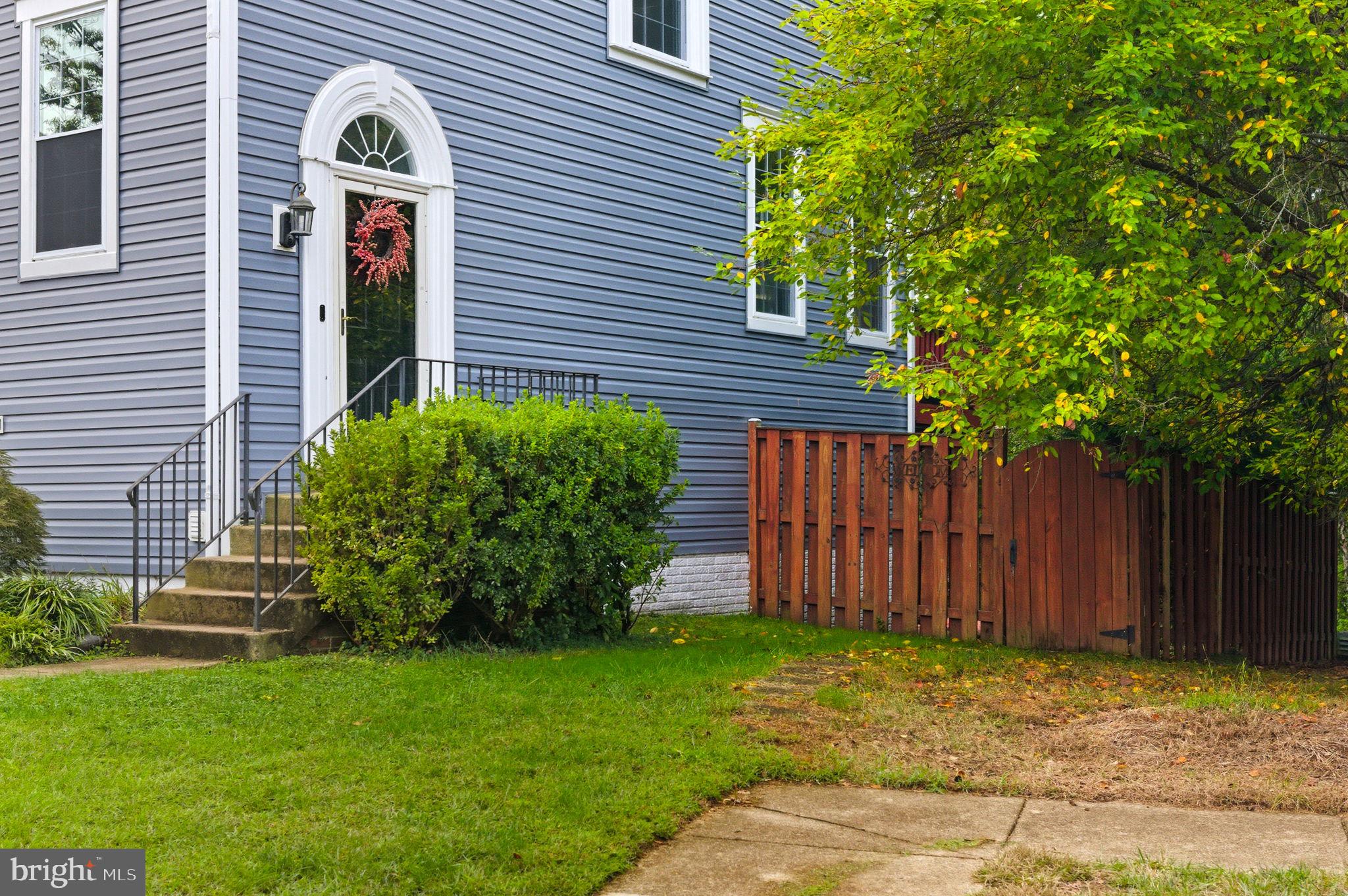 47587 Comer Square Sterling, VA 20165 - Photo 3 of 77 a front view of a house with garden
