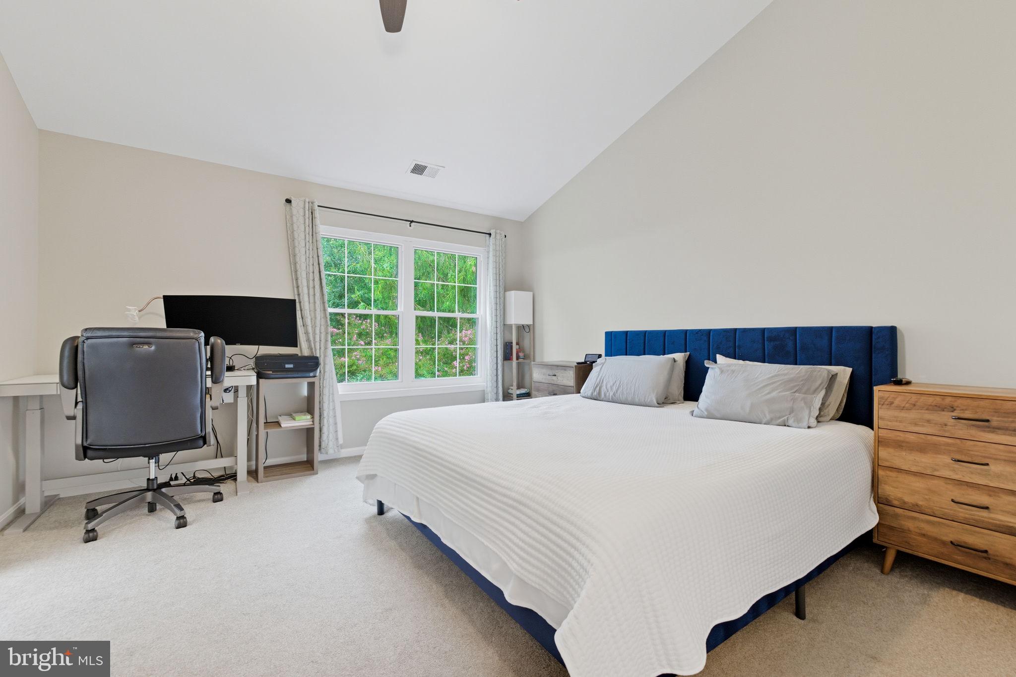 47587 Comer Square Sterling, VA 20165 - Photo 32 of 77 a bedroom with a bed and a flat screen tv