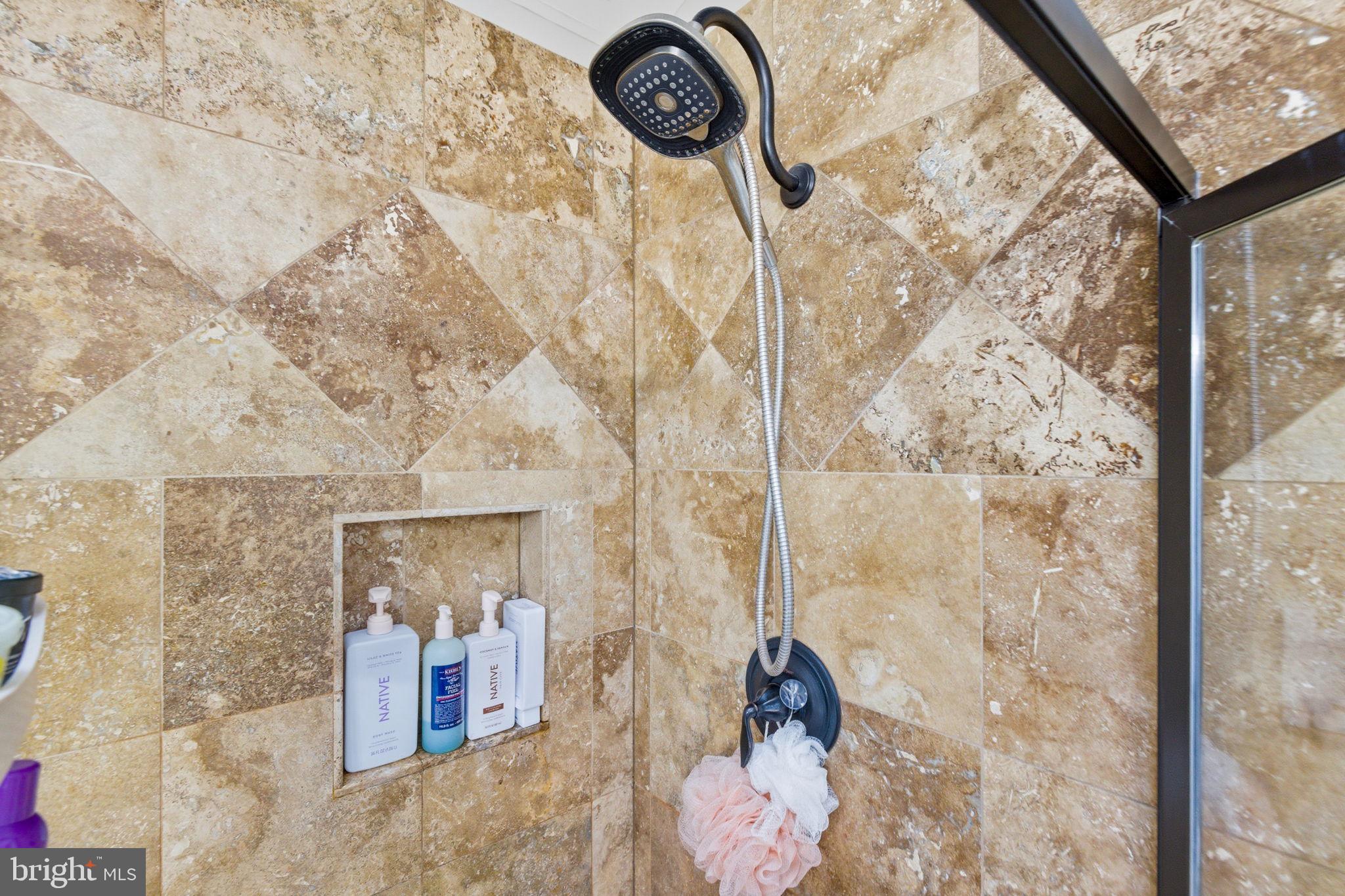 47587 Comer Square Sterling, VA 20165 - Photo 39 of 77 a bathroom with a granite countertop sink a mirror and shower
