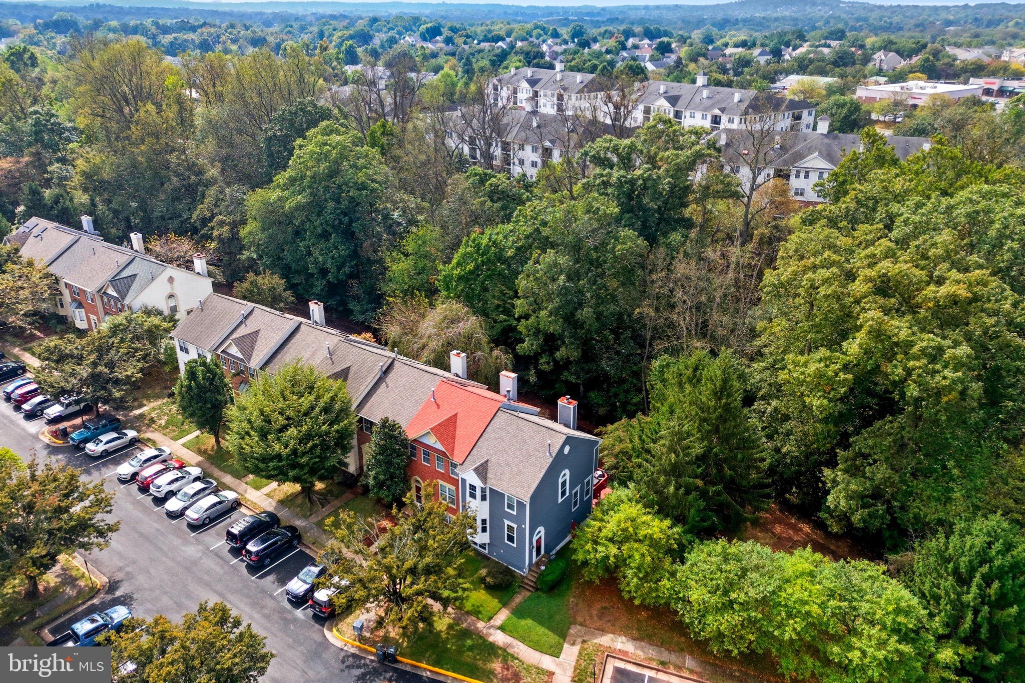 47587 Comer Square Sterling, VA 20165 - Photo 4 of 77 an aerial view of a house with a yard and outdoor seating