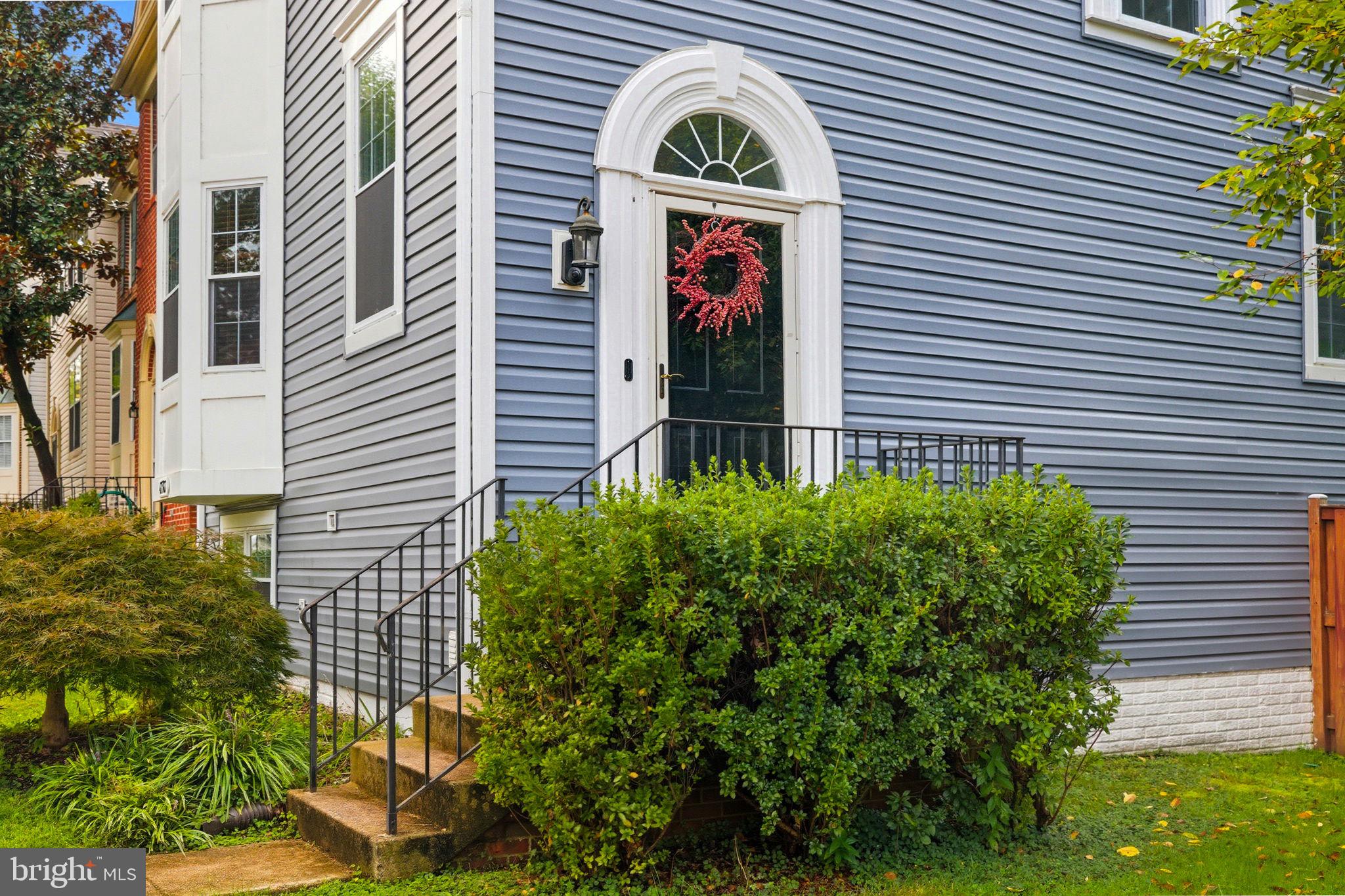 47587 Comer Square Sterling, VA 20165 - Photo 5 of 77 a front view of a house with garden