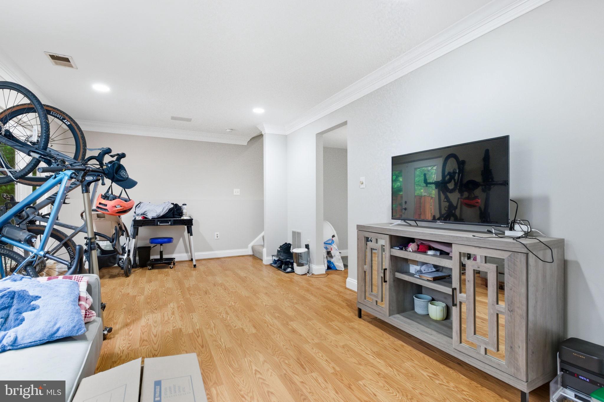 47587 Comer Square Sterling, VA 20165 - Photo 53 of 77 a view of a room with furniture and a flat screen tv