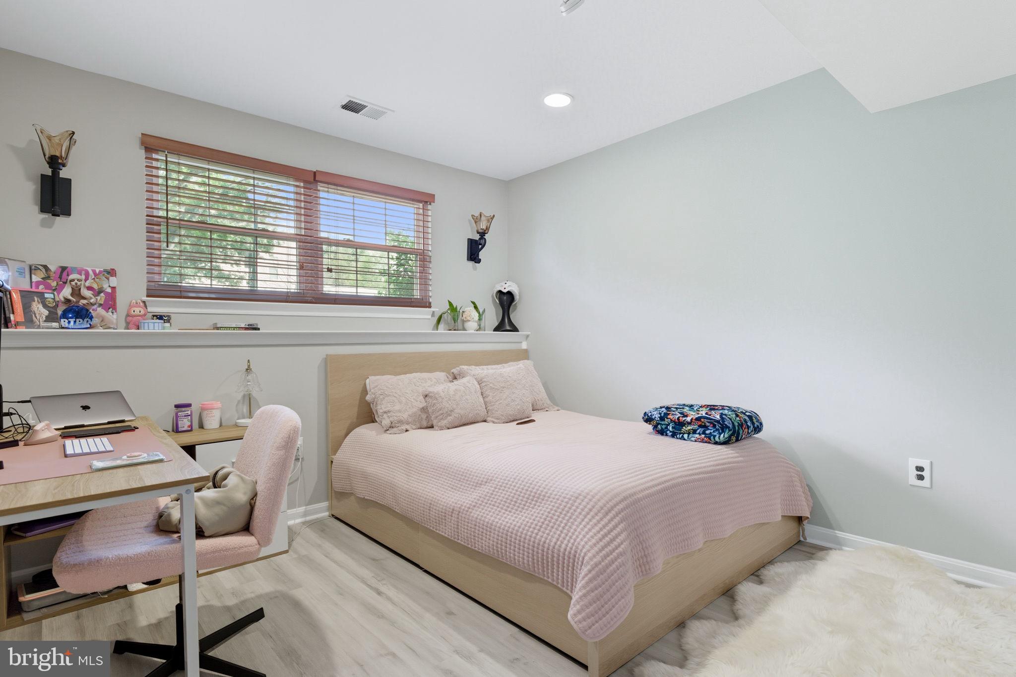 47587 Comer Square Sterling, VA 20165 - Photo 57 of 77 a bedroom with a bed a window and chair