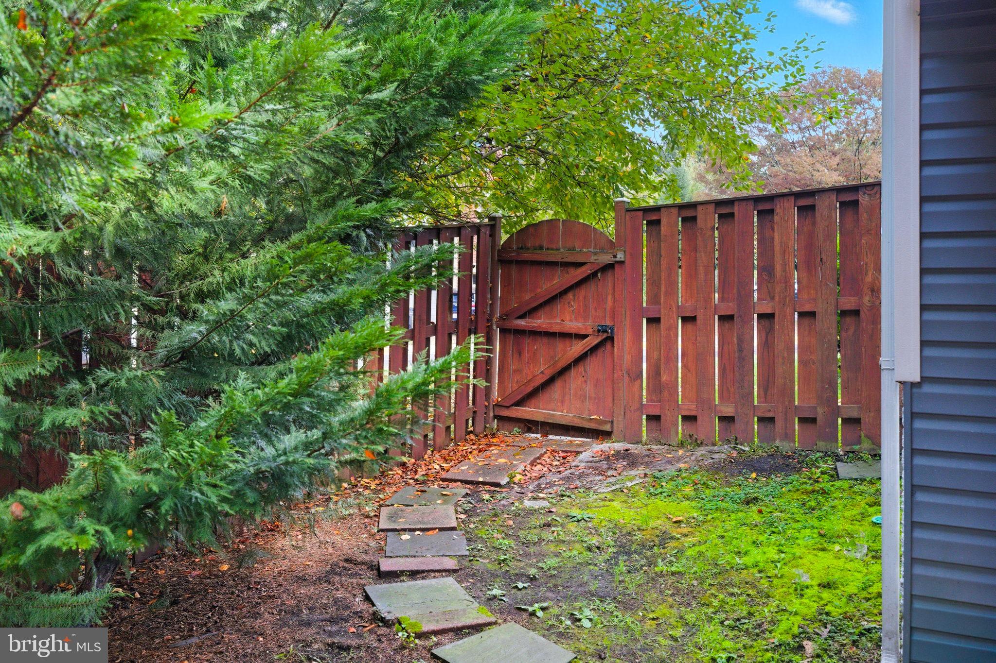 47587 Comer Square Sterling, VA 20165 - Photo 62 of 77 a view of a backyard with wooden fence