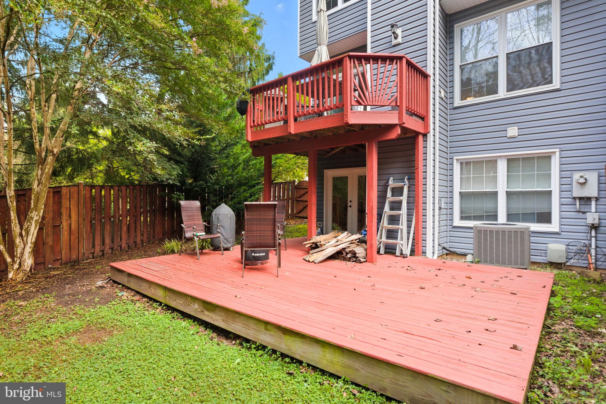 47587 Comer Square Sterling, VA 20165 - Photo 65 of 77 a wooden bench sitting in front of a building
