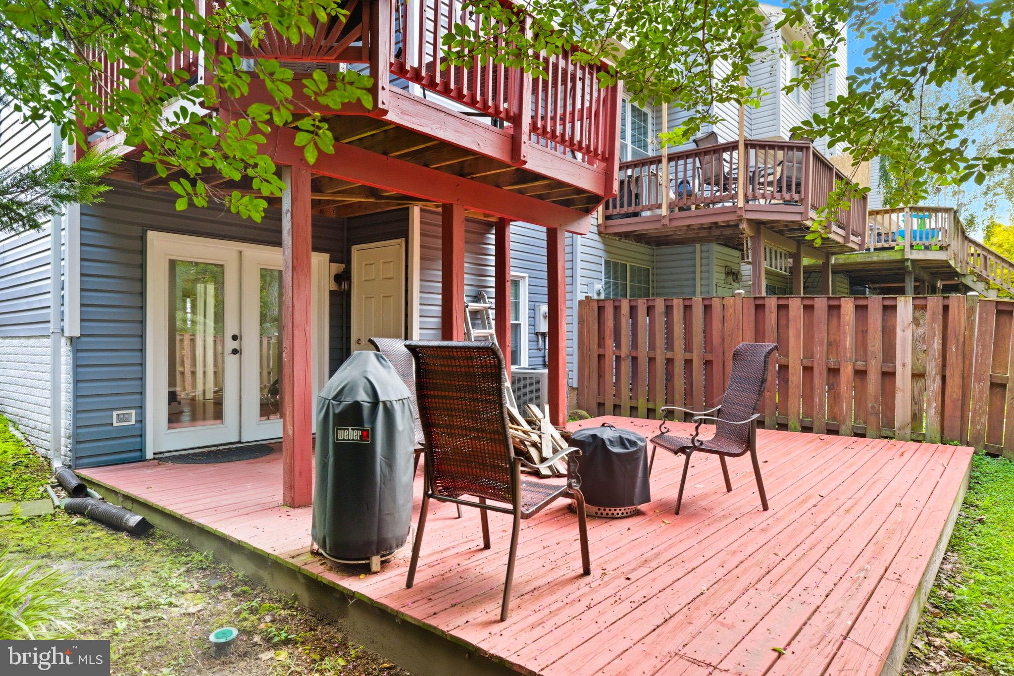 47587 Comer Square Sterling, VA 20165 - Photo 66 of 77 a view of a chairs and table in the patio in front of the house