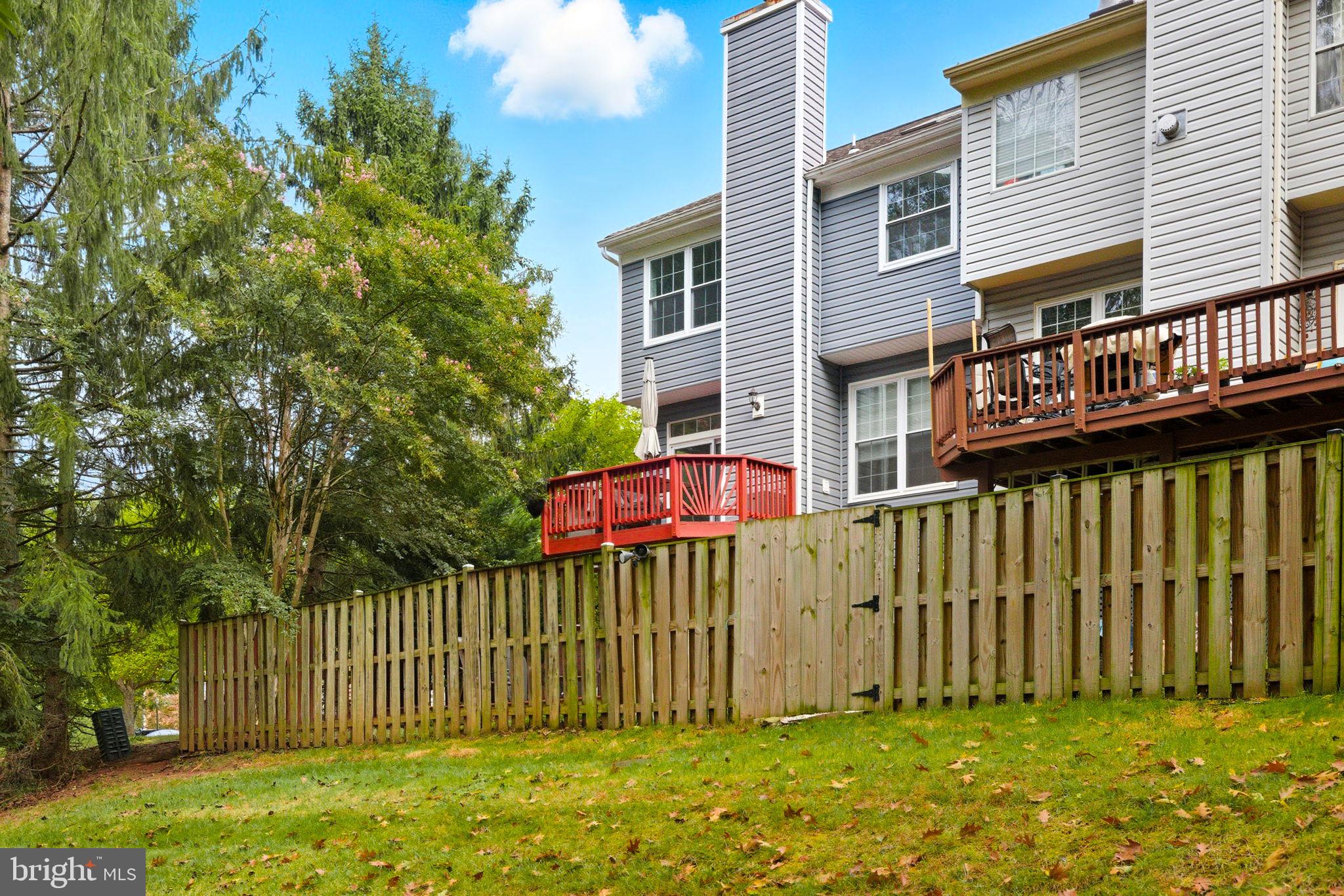 47587 Comer Square Sterling, VA 20165 - Photo 68 of 77 a front view of a house with a garden